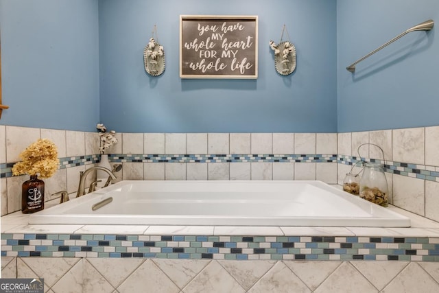 bathroom with a relaxing tiled tub