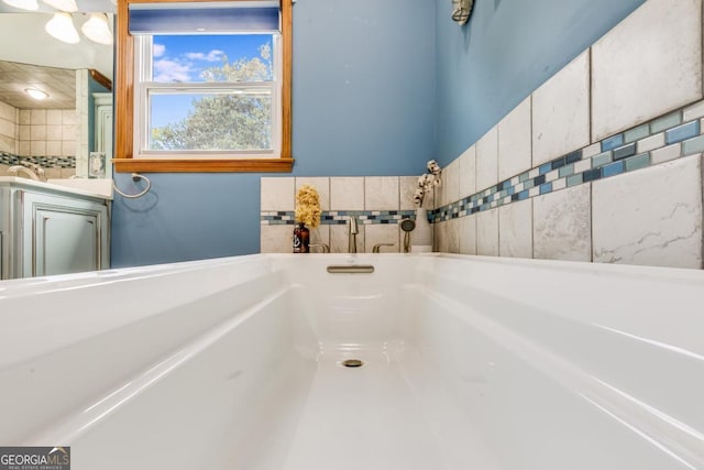 bathroom with a tub to relax in