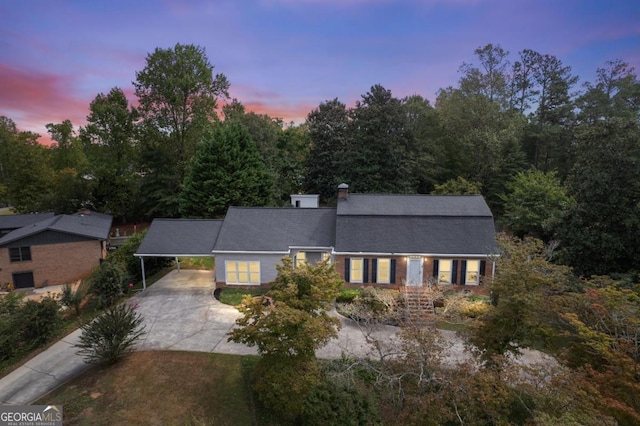 view of front of property with a carport