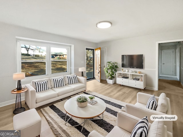 living room with light hardwood / wood-style floors