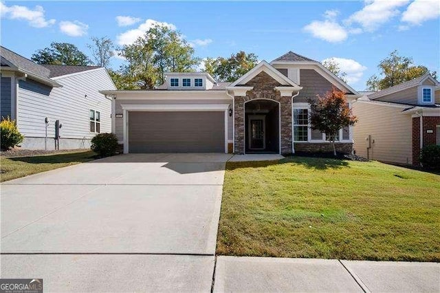 view of front of property featuring a garage and a front yard