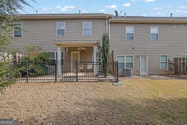 rear view of property featuring central air condition unit, ceiling fan, and a patio area