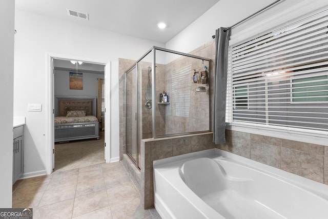 bathroom with vanity, independent shower and bath, and tile patterned flooring