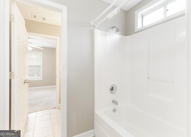 bathroom featuring tile patterned floors and tub / shower combination