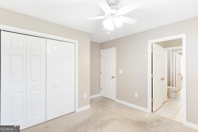 unfurnished bedroom featuring light carpet, a closet, and ceiling fan