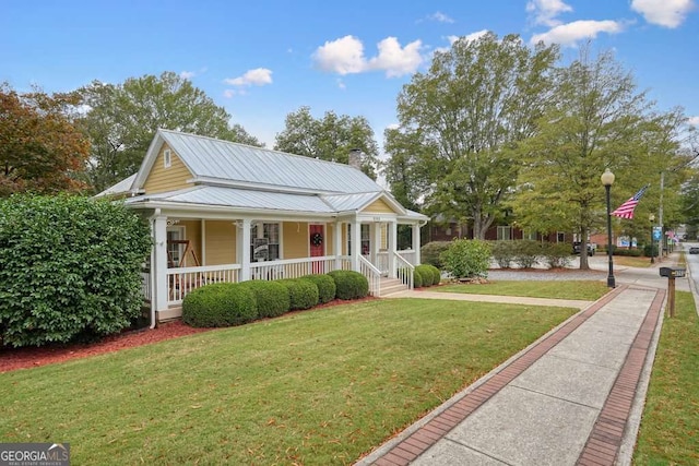 view of front facade with a front yard and a porch