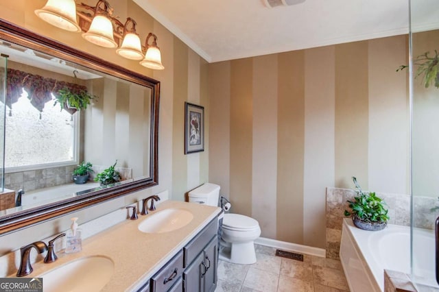 bathroom featuring a tub to relax in, toilet, and vanity