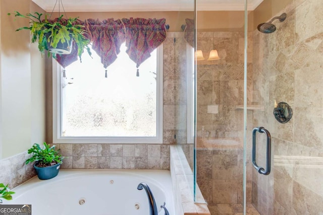 bathroom featuring crown molding and separate shower and tub