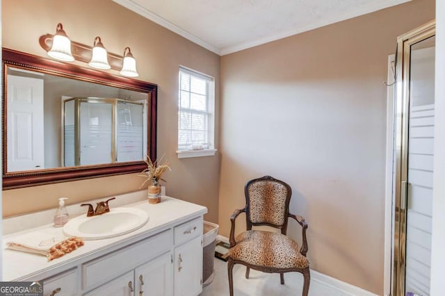 bathroom featuring crown molding, vanity, and a shower with door