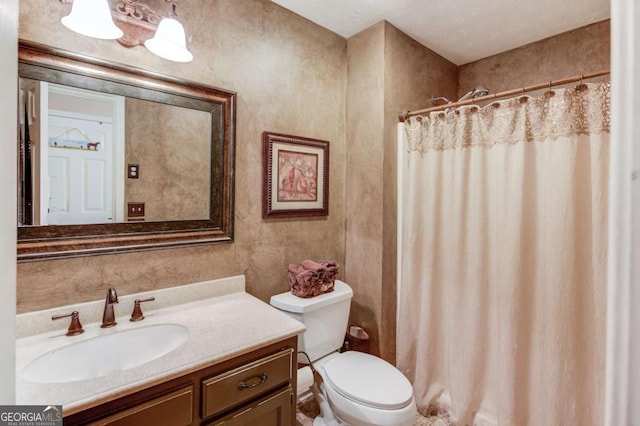 bathroom featuring a shower with curtain, vanity, and toilet