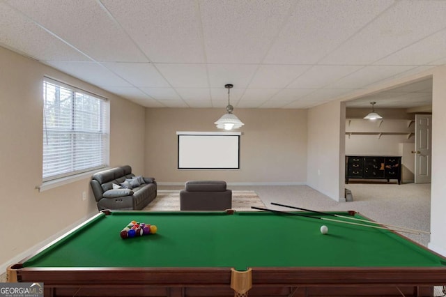 rec room with a paneled ceiling and carpet flooring