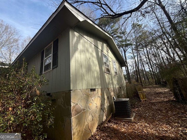 view of home's exterior with cooling unit