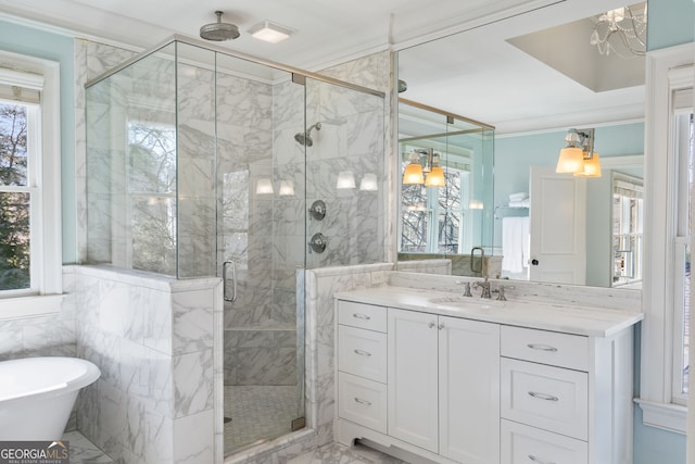 bathroom featuring crown molding, shower with separate bathtub, tile walls, and vanity