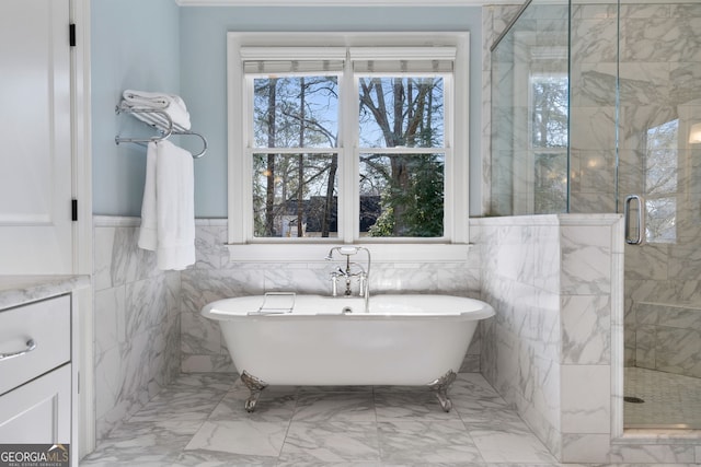 bathroom with independent shower and bath and tile walls