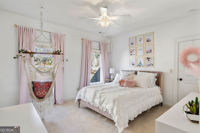 carpeted bedroom featuring ceiling fan