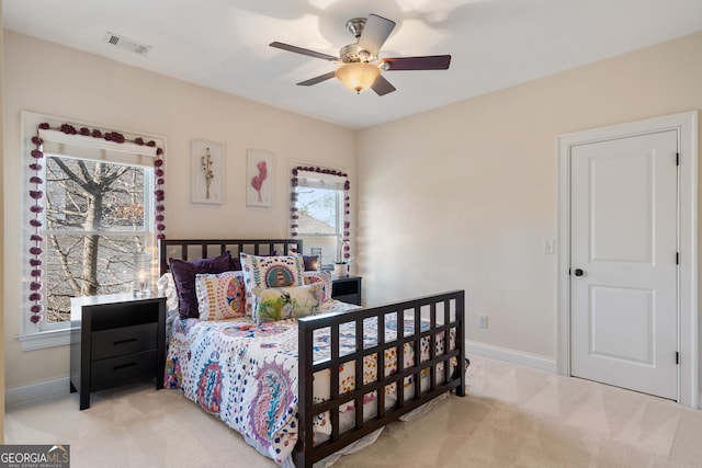 carpeted bedroom with ceiling fan