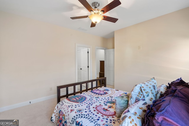 bedroom featuring ceiling fan and carpet