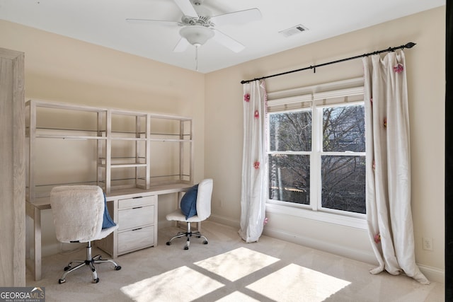 unfurnished office with light colored carpet and ceiling fan