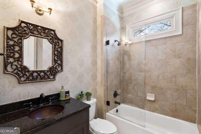 full bathroom with tiled shower / bath combo, vanity, and toilet