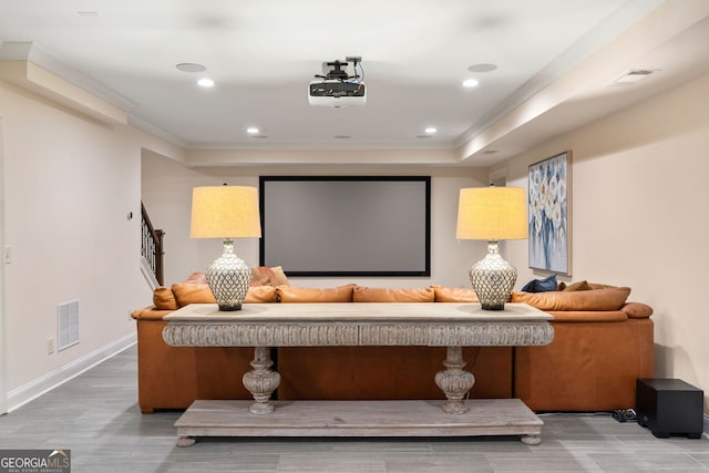 home theater with hardwood / wood-style flooring and ornamental molding