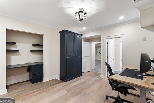 home office with ornamental molding and light wood-type flooring