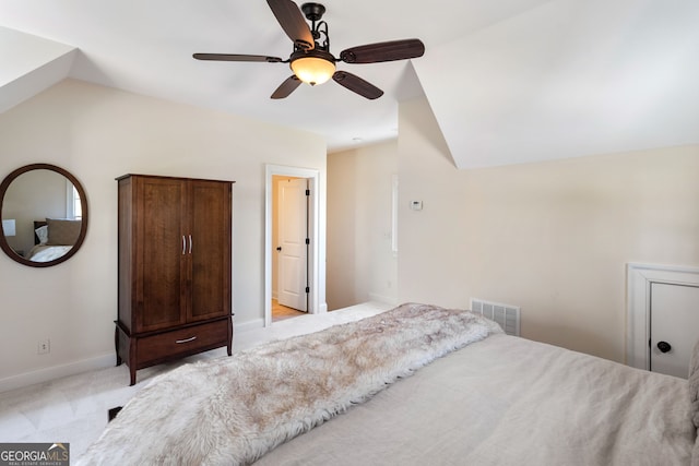 carpeted bedroom with lofted ceiling and ceiling fan