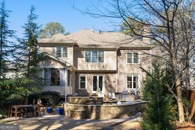 rear view of property featuring a patio area