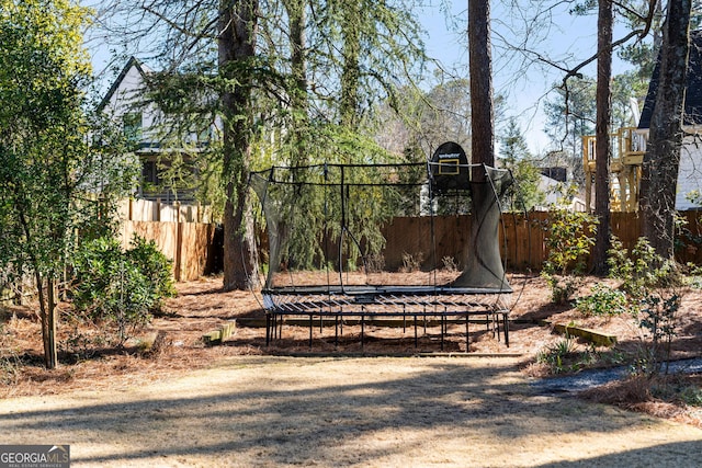 view of yard with a trampoline