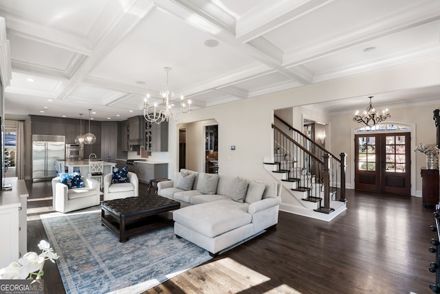 living room featuring coffered ceiling, beam ceiling, dark hardwood / wood-style flooring, and a chandelier