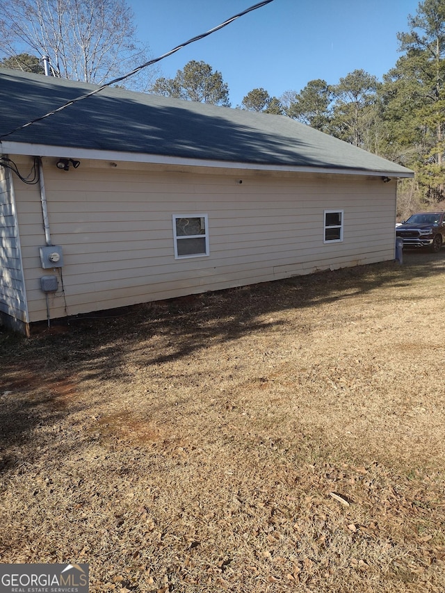 view of home's exterior with a yard