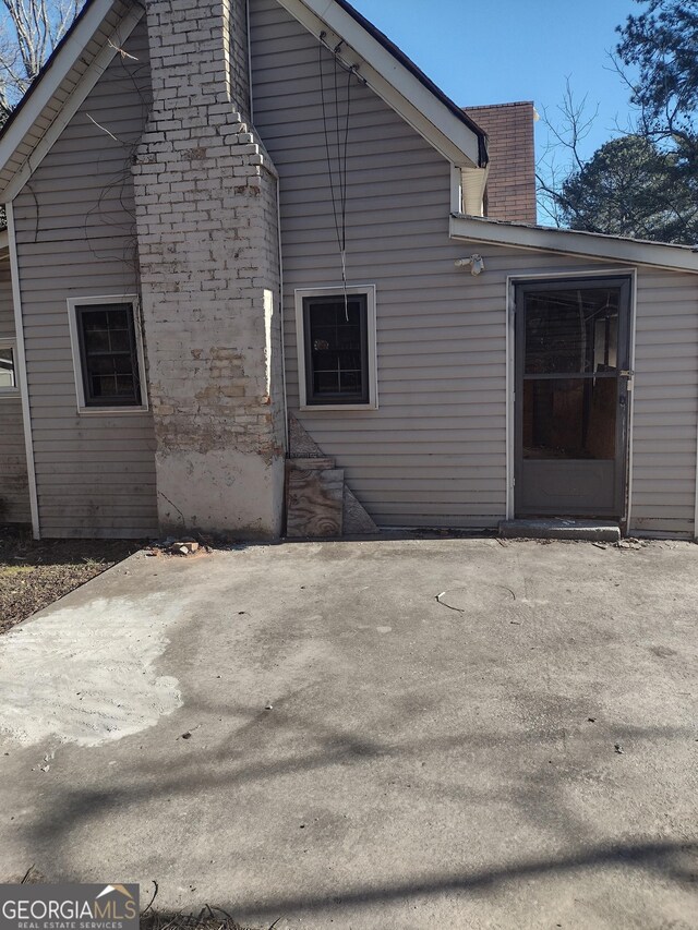 rear view of property featuring a patio