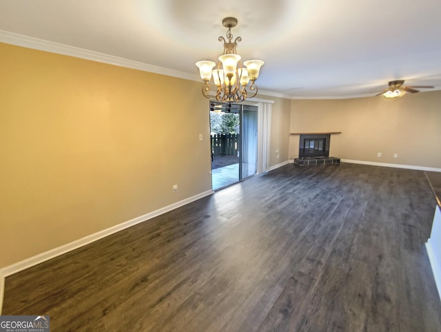 unfurnished living room featuring crown molding, ceiling fan with notable chandelier, and dark hardwood / wood-style floors