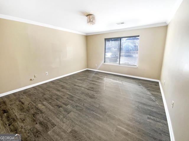 unfurnished room featuring ornamental molding and dark wood-type flooring