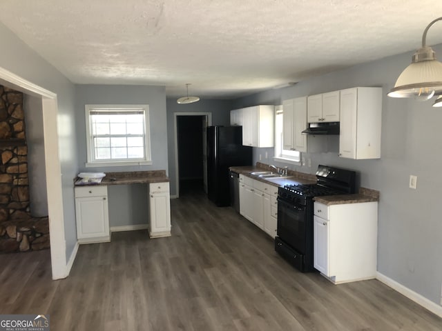 5250 Hollyhock Rd, Douglasville, GA 30135 - kitchen with black appliances, under cabinet range hood, a sink, white cabinets, and a textured ceiling