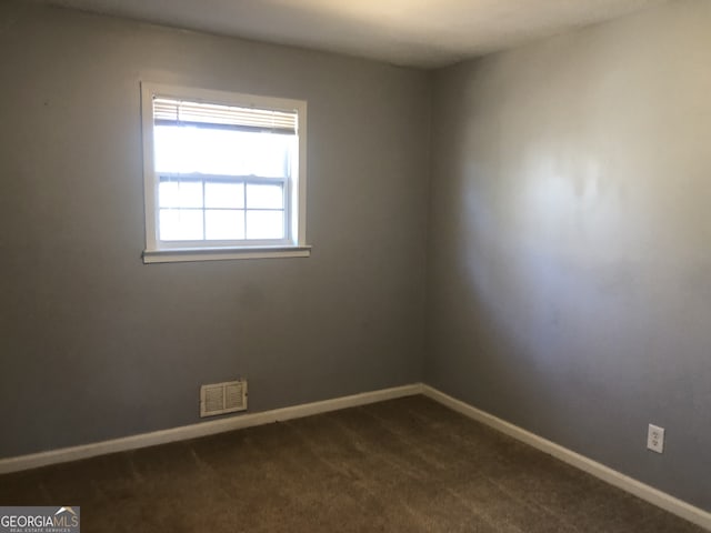 5250 Hollyhock Rd, Douglasville, GA 30135 - empty room featuring baseboards and dark carpet