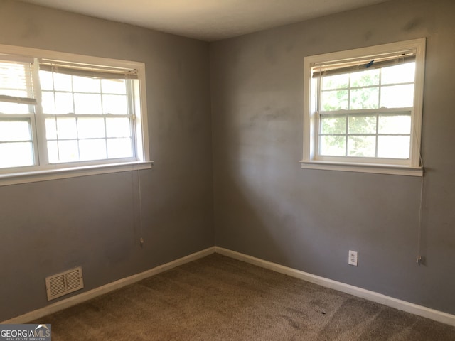 5250 Hollyhock Rd, Douglasville, GA 30135 - carpeted empty room with baseboards