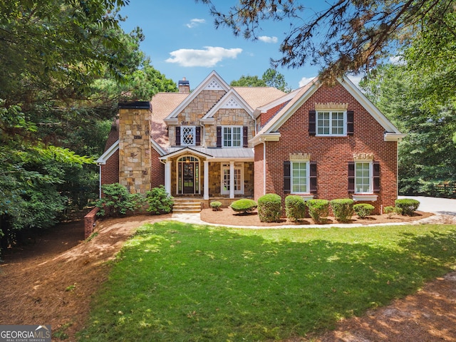 102 Townsend Pass, Alpharetta, GA 30004 - craftsman-style home with a chimney, a front yard, stone siding, and a standing seam roof