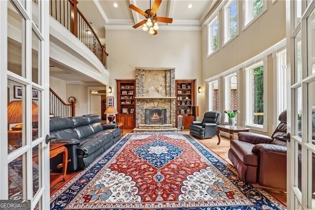 living room featuring french doors, coffered ceiling, beam ceiling, and a high ceiling