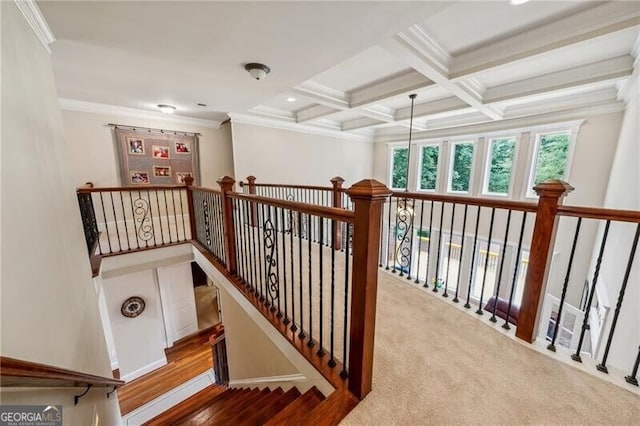 hallway with coffered ceiling, beam ceiling, and crown molding