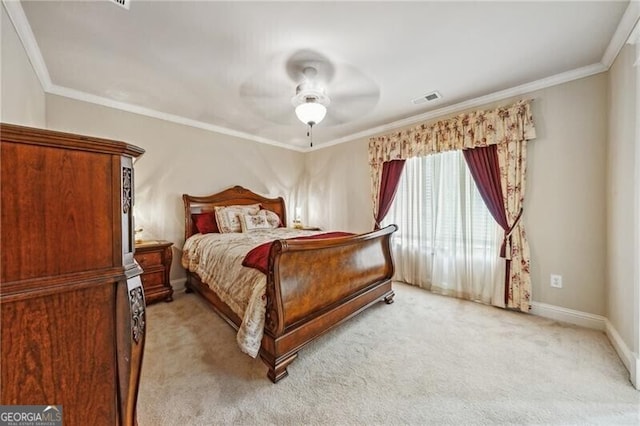 carpeted bedroom with crown molding and ceiling fan