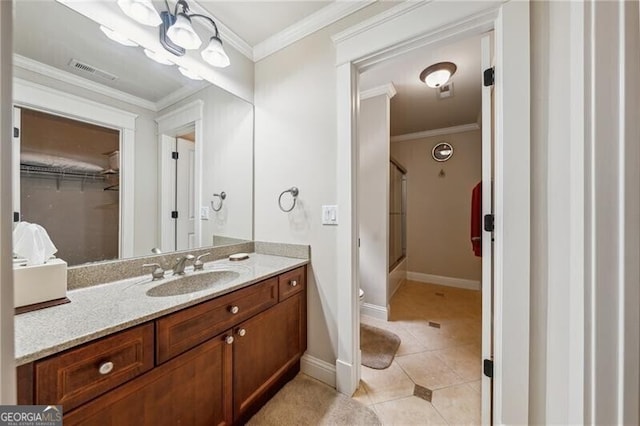 bathroom featuring crown molding, tile patterned floors, shower / bath combination with glass door, and vanity