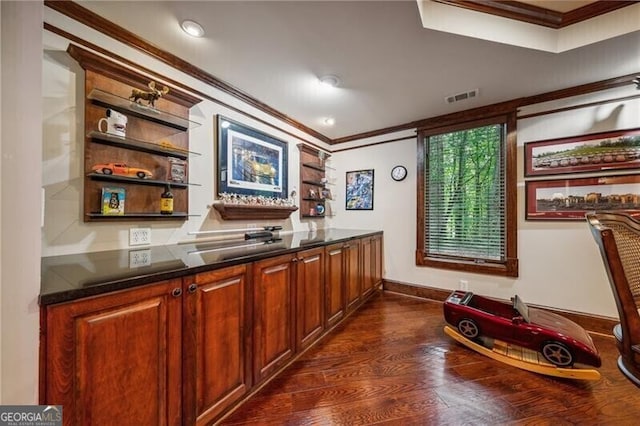 bar with crown molding and dark wood-type flooring