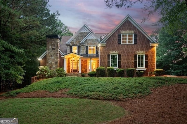 102 Townsend Pass, Alpharetta, GA 30004 - view of front facade with a front lawn, a chimney, and brick siding