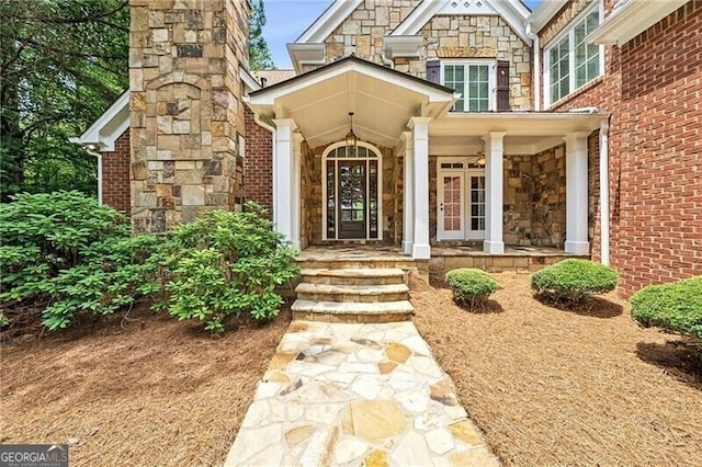 102 Townsend Pass, Alpharetta, GA 30004 - doorway to property with stone siding and covered porch