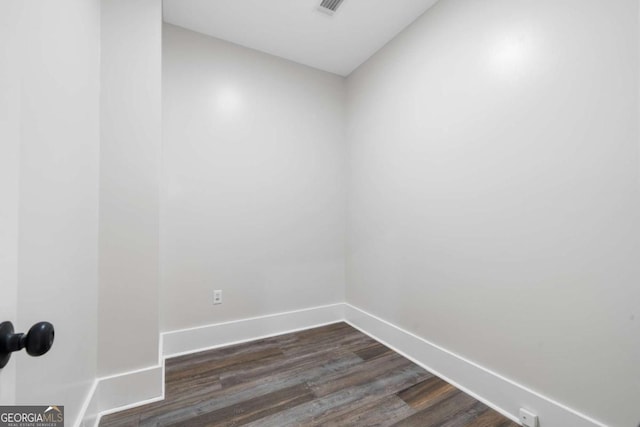 spare room featuring dark hardwood / wood-style floors