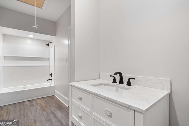 bathroom featuring vanity, shower / washtub combination, and hardwood / wood-style floors