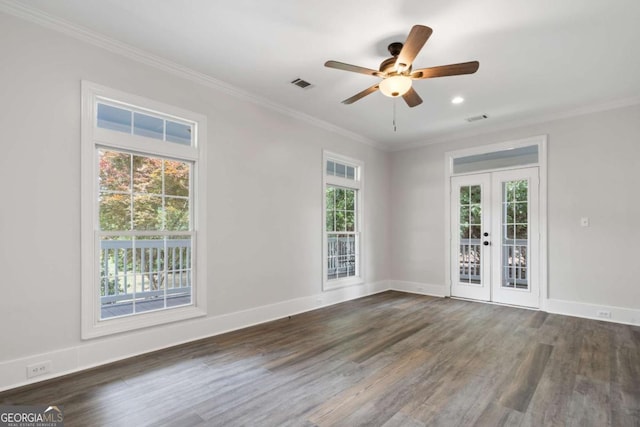 empty room with dark wood-type flooring, ornamental molding, french doors, and ceiling fan