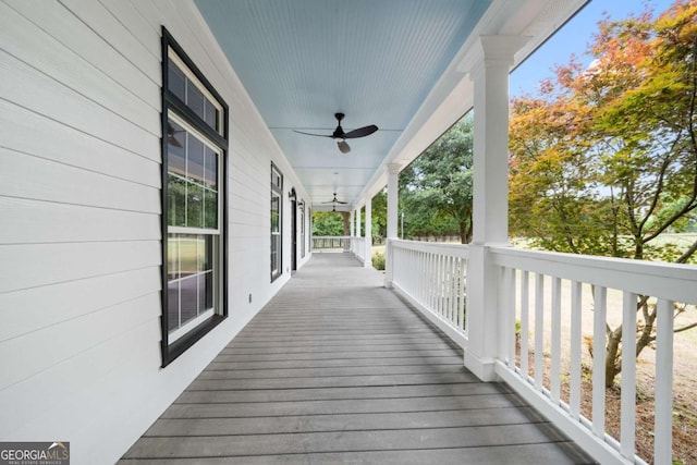 wooden terrace featuring ceiling fan