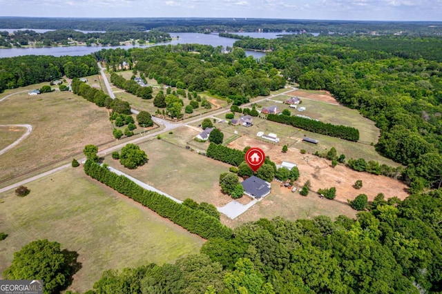 birds eye view of property featuring a rural view and a water view