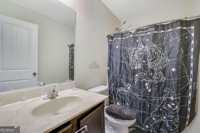 bathroom with vanity, toilet, and a shower with shower curtain